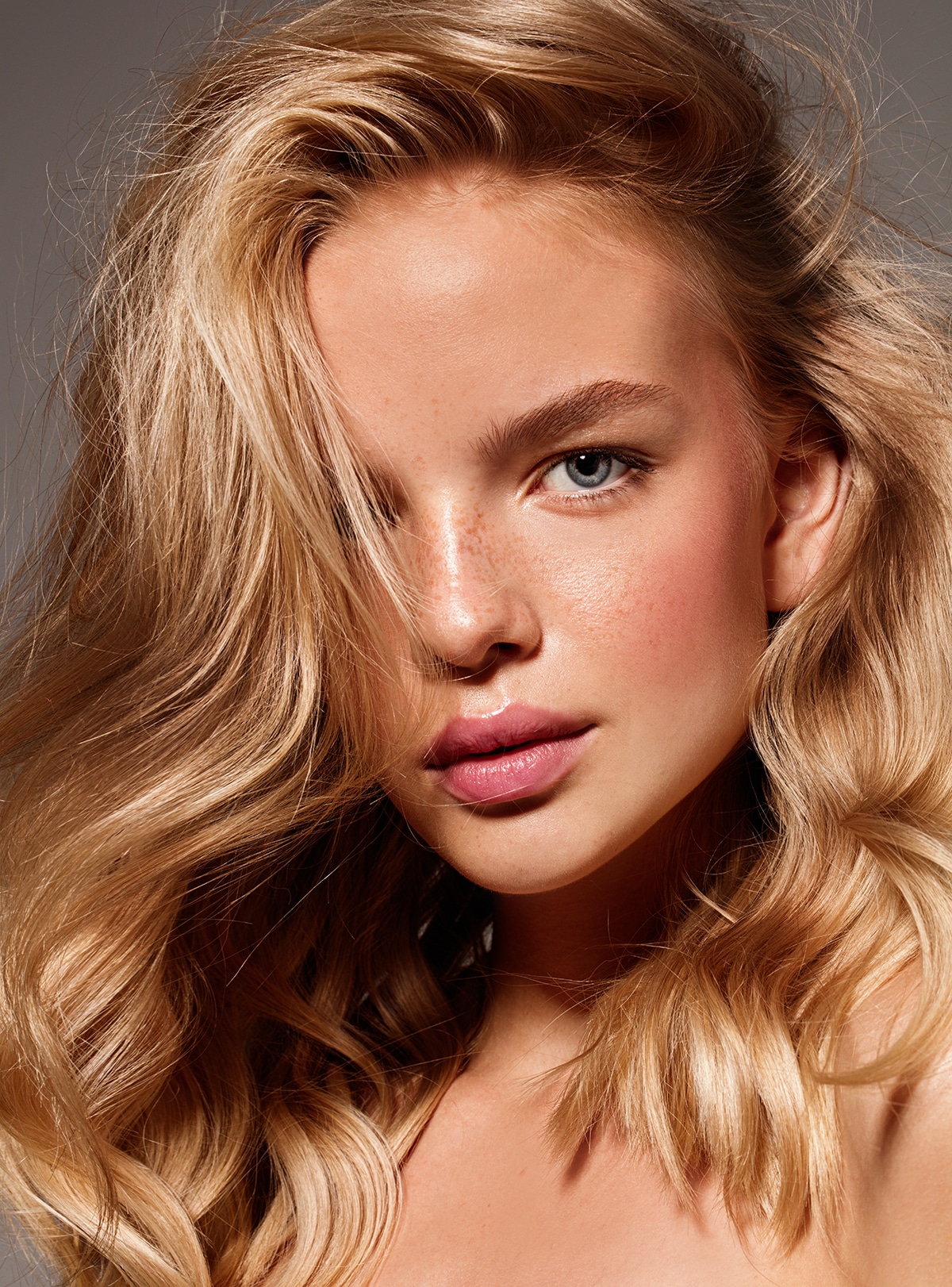 Blonde model with natural make up. Studio shot.