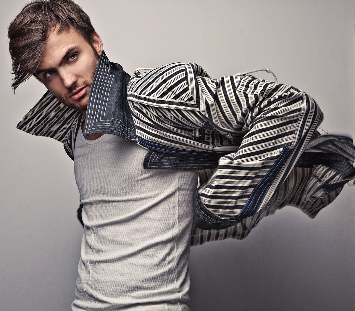 Elegant young handsome man. Studio fashion portrait.